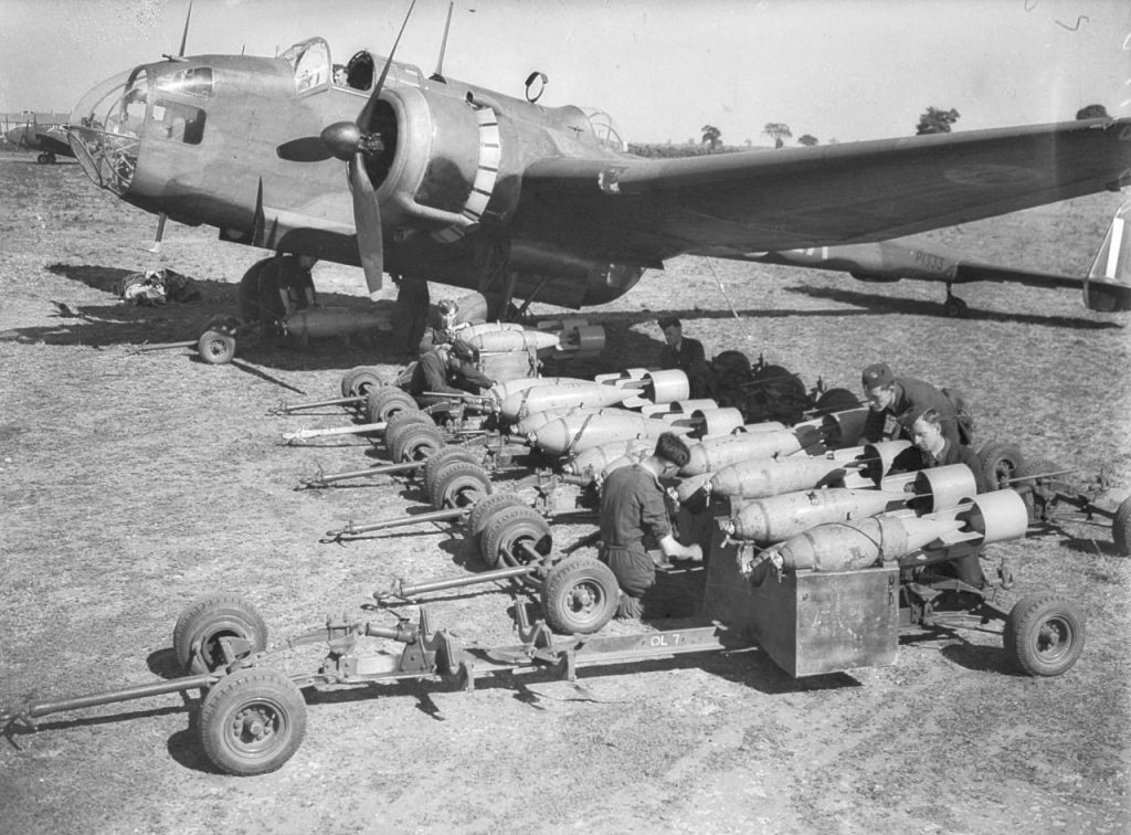 Loading bombs onto a World War II plane