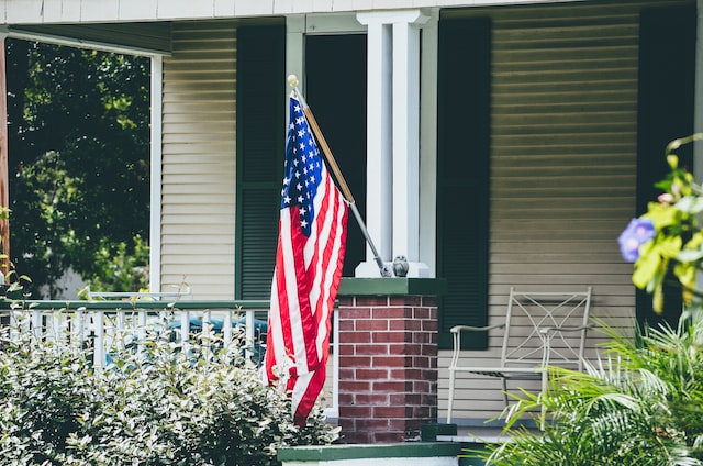 American Flag in front of the residential house